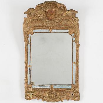 A second half of the 18th century rococo mirror sconce.