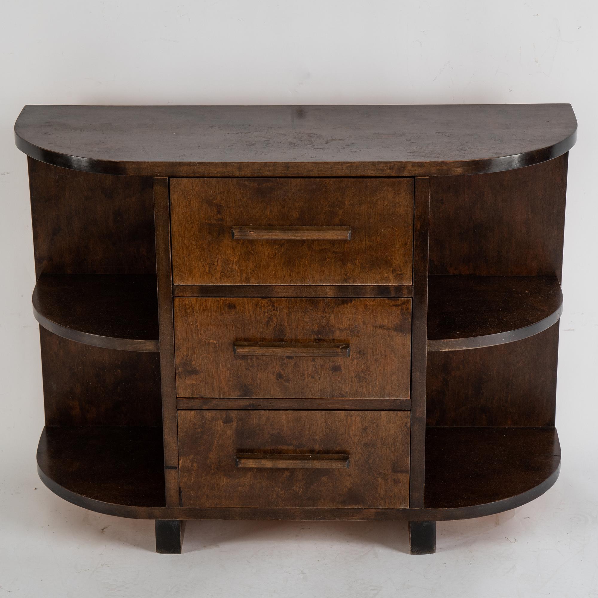 A stained birch chest of drawers and mirror, 1930's.
