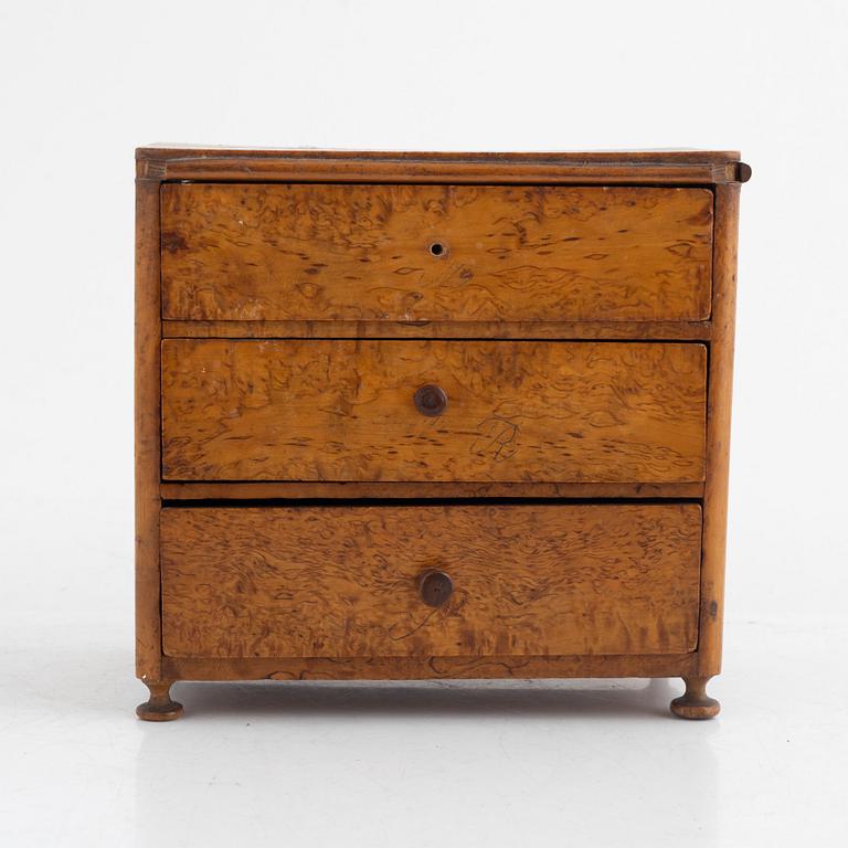 A Swedish miniature commode, 19th century.