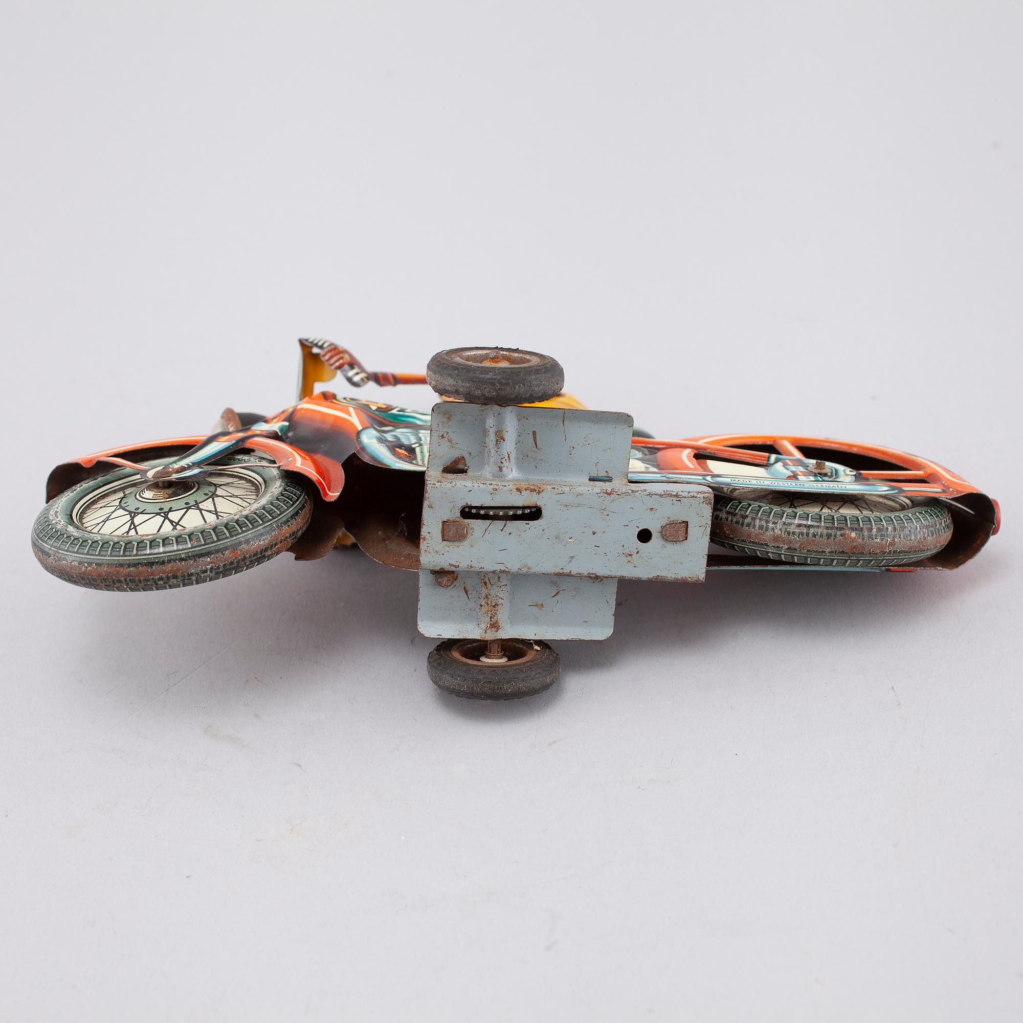 A mid 20th century "Arnold" tin toy.