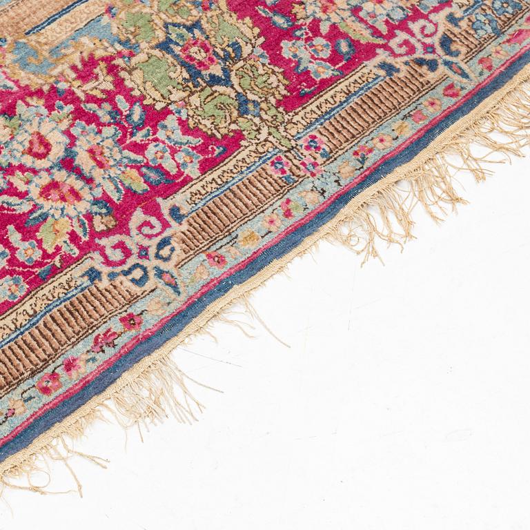 A carpet, Kerman, ca 358 x 275 cm.