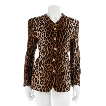 418. KENZO, a leopard printed jacket, size 38.