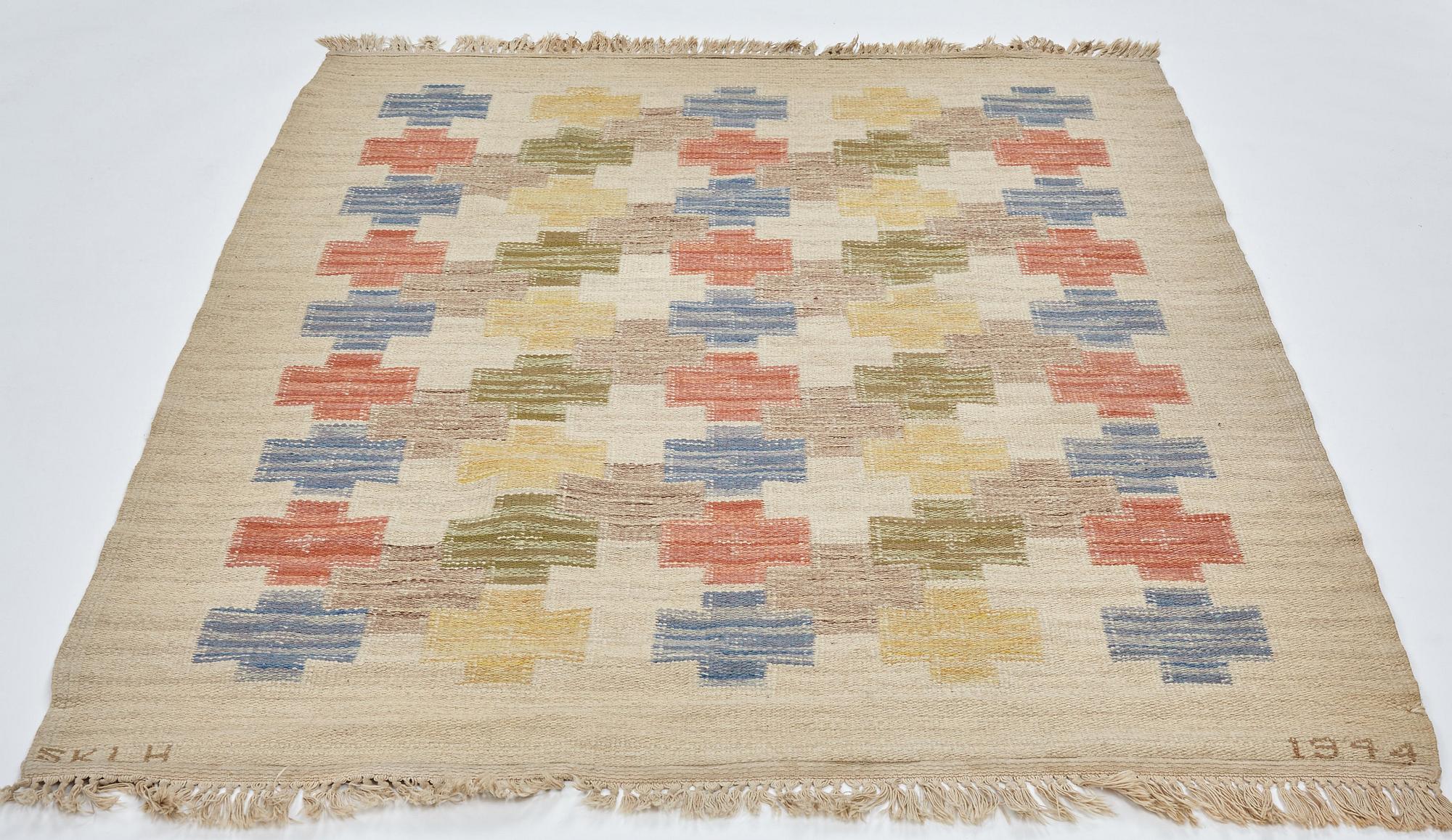 Swedish design, a carpet, knotted pile in relief, ca 178,5-179,5 x 137-140,5 cm, signed and dated at the back: SKLH 1944.