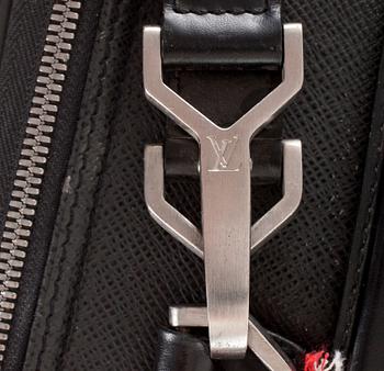 LOUIS VUITTON, a black leather suitcase, "Pegase".