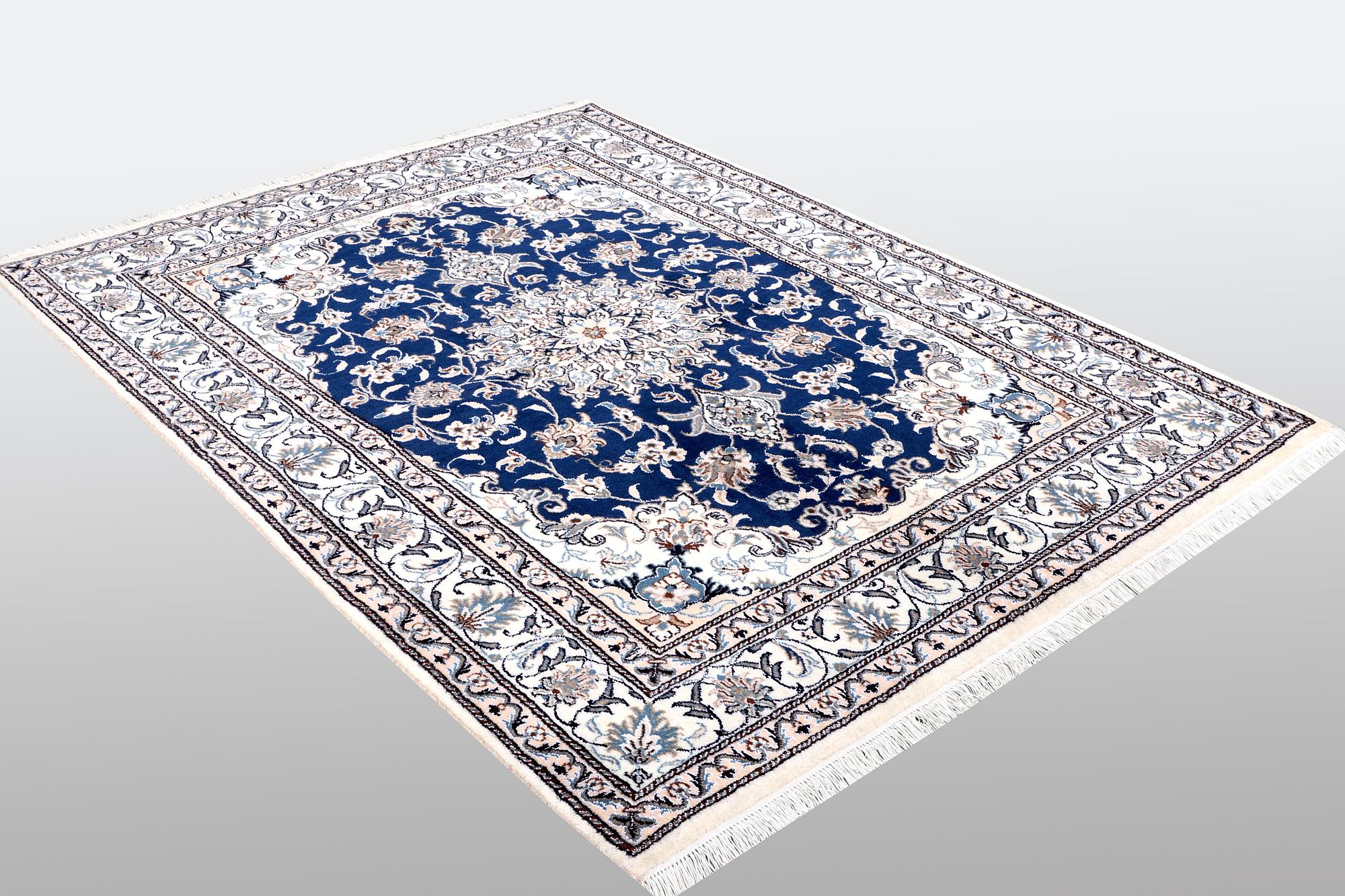 A Nain rug, part silk, ca 205 x 152 cm.