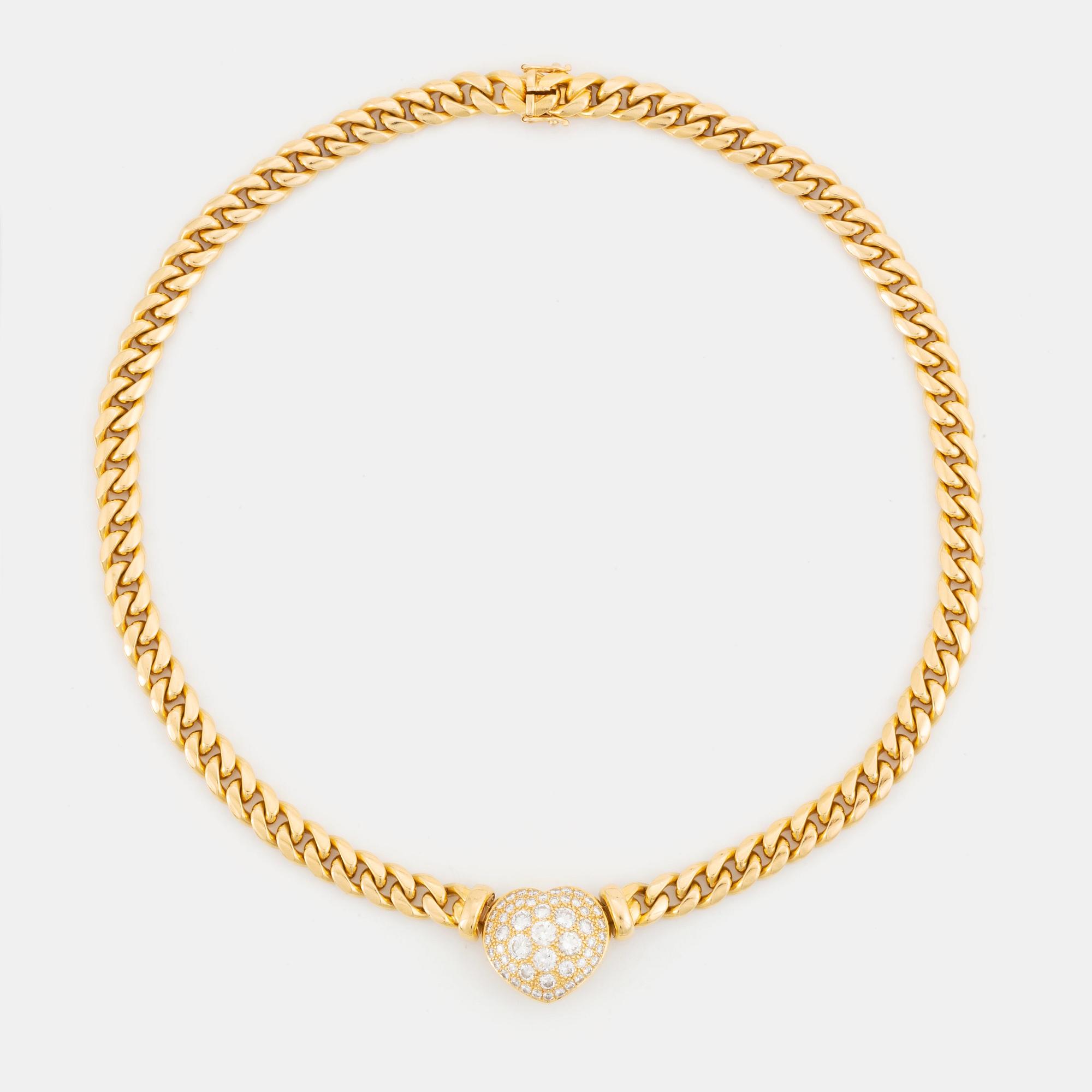 An 18K gold necklace set with round brilliant-cut diamonds.