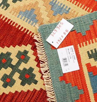 A Kilim runner carpet, c. 196 x 88 cm.