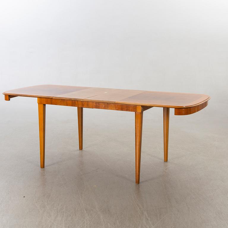 A 1950/60's dining table and chairs.