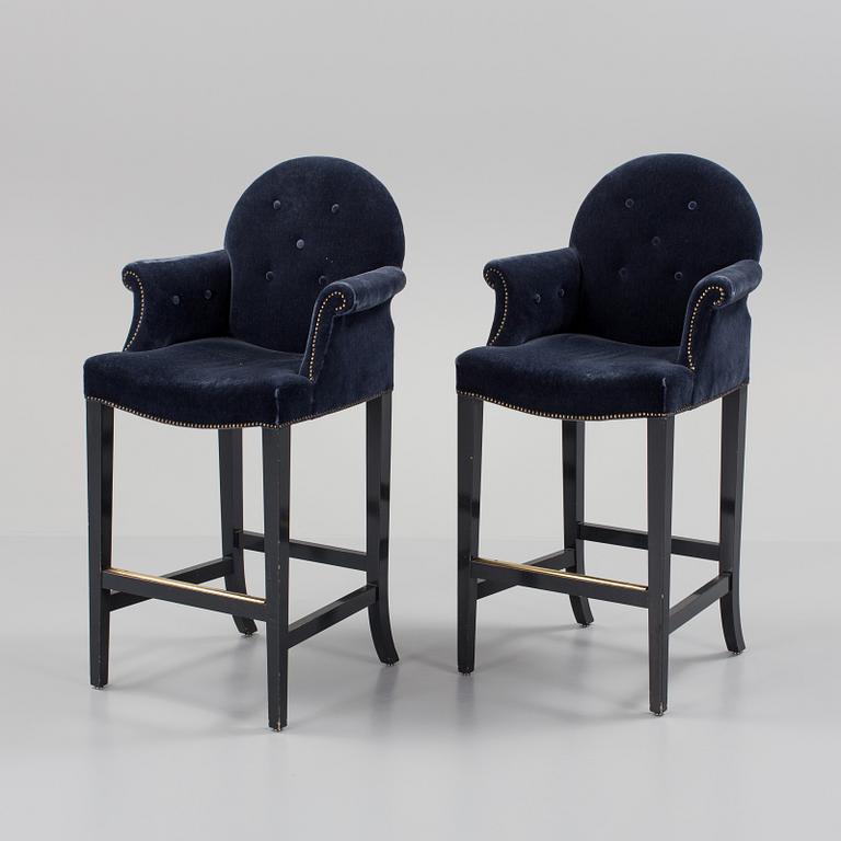 A pair of "The Simplified Moonback Counter Height Stool" barstools by Soane Britain.