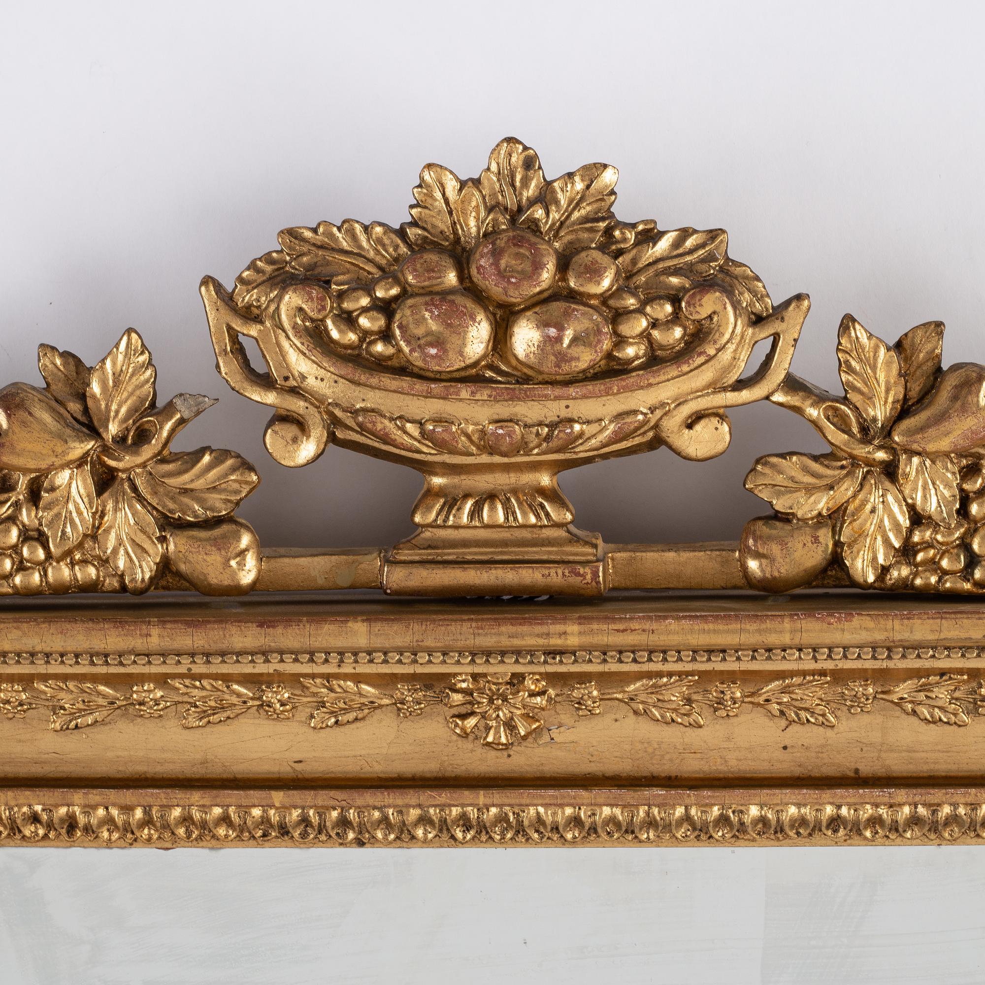 A pair of Swedish Empire mirror wall sconces, first half of the 19th century.