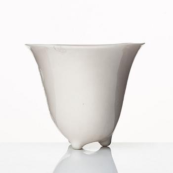 A rhinoserous shaped blanc de chine libation cup, Qing dynasty.