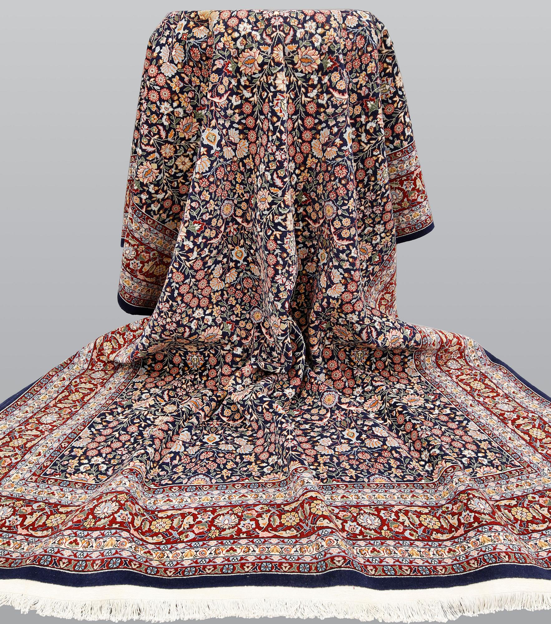A signed Hereke carpet, ca 340 x 246 cm.