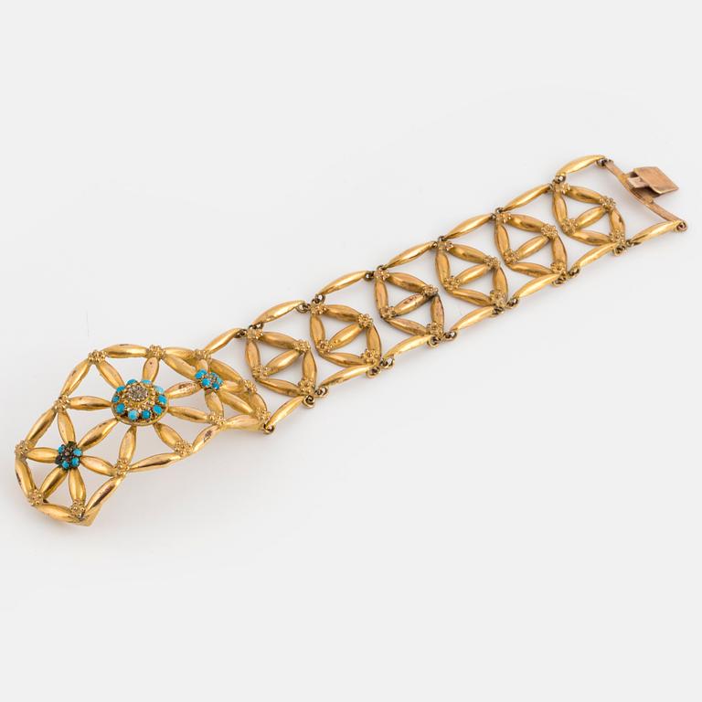 A 14K and low fineness gold bracelet set with blue stones.