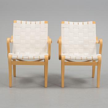 a pair of "Mina" armchairs by Bruno Matsson.