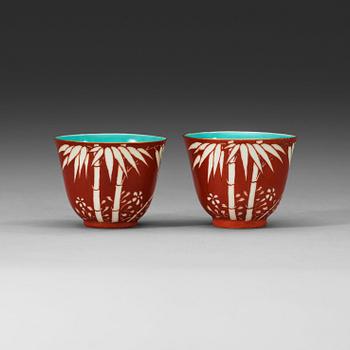 74. A pair of coral-red ground "Bamboo" cups, Qing dynasty, 19th Century.