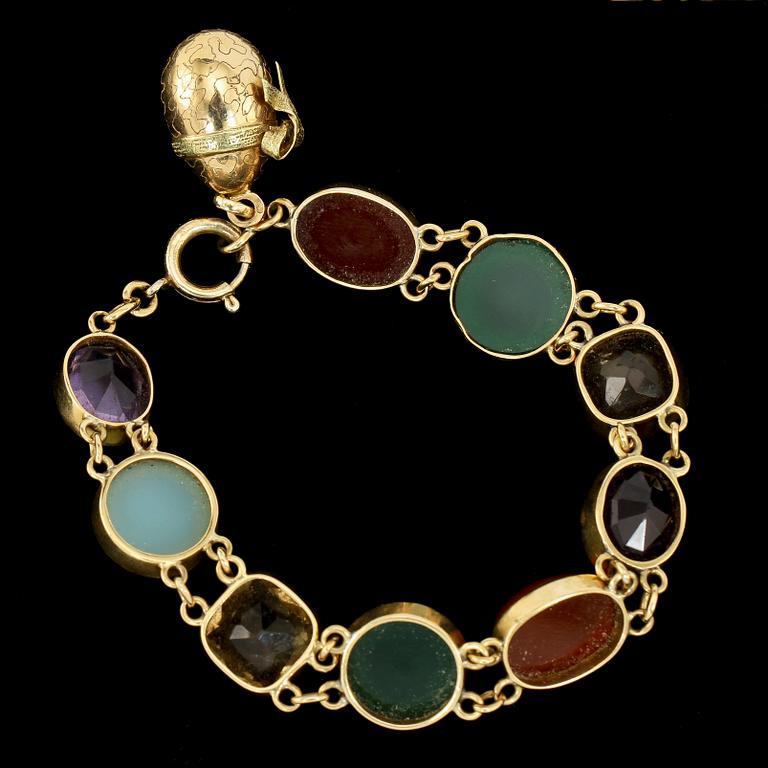 ARMBAND, 18k guld med cabochonslipade och fasettslipade stenar, 1900-tal. Vikt 27.