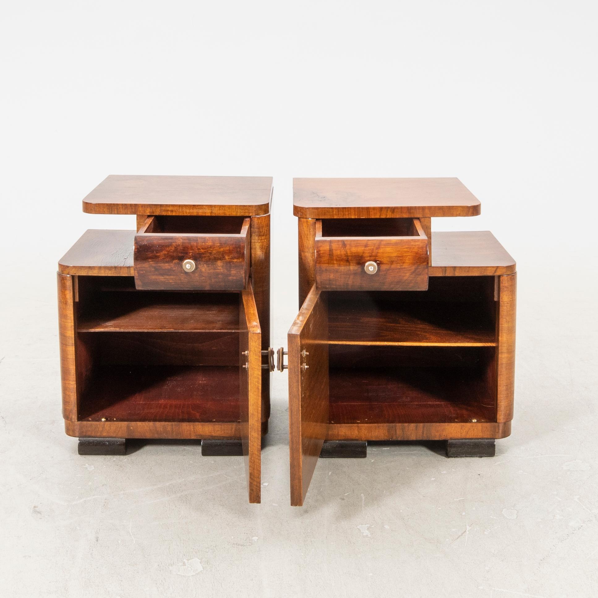 A pair of Art deco walnut bedside tables.