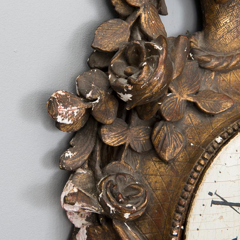 A 18th century wall clock.