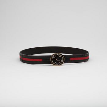 GUCCI and CHANEL, three leather belts.