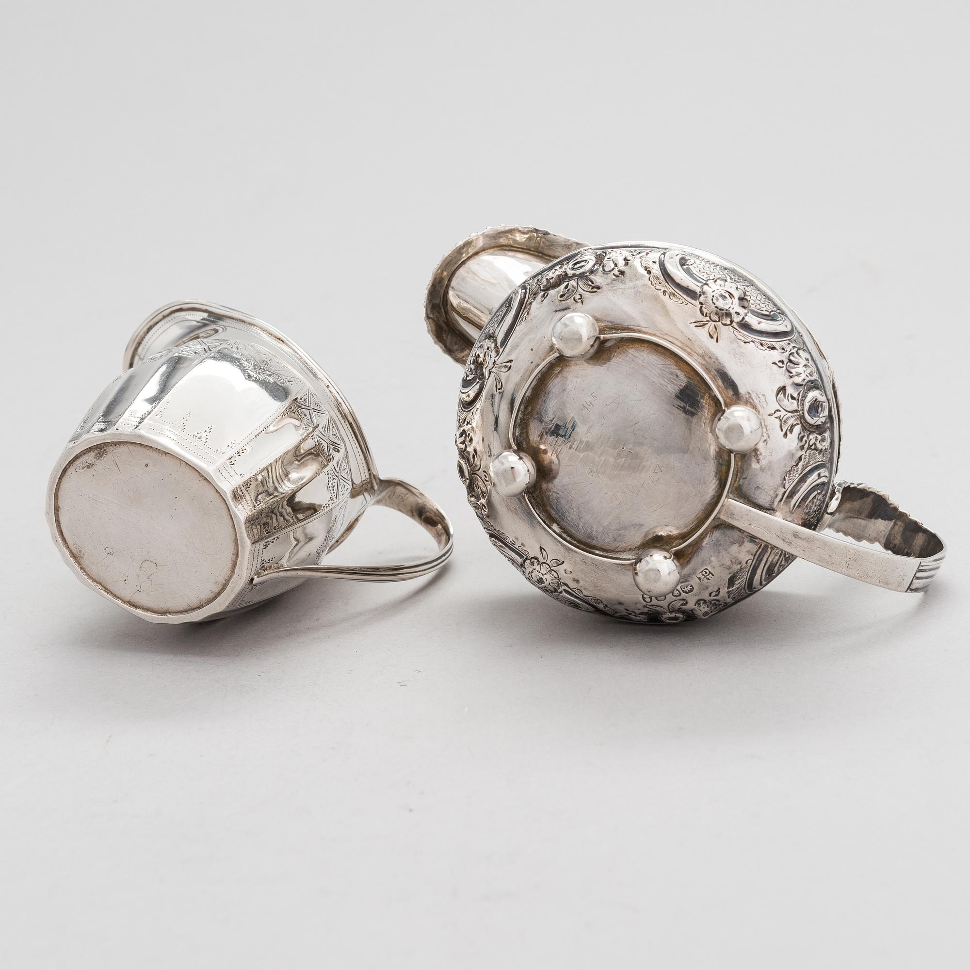 Two sterling silver milk jugs, London 1794 och 1828.