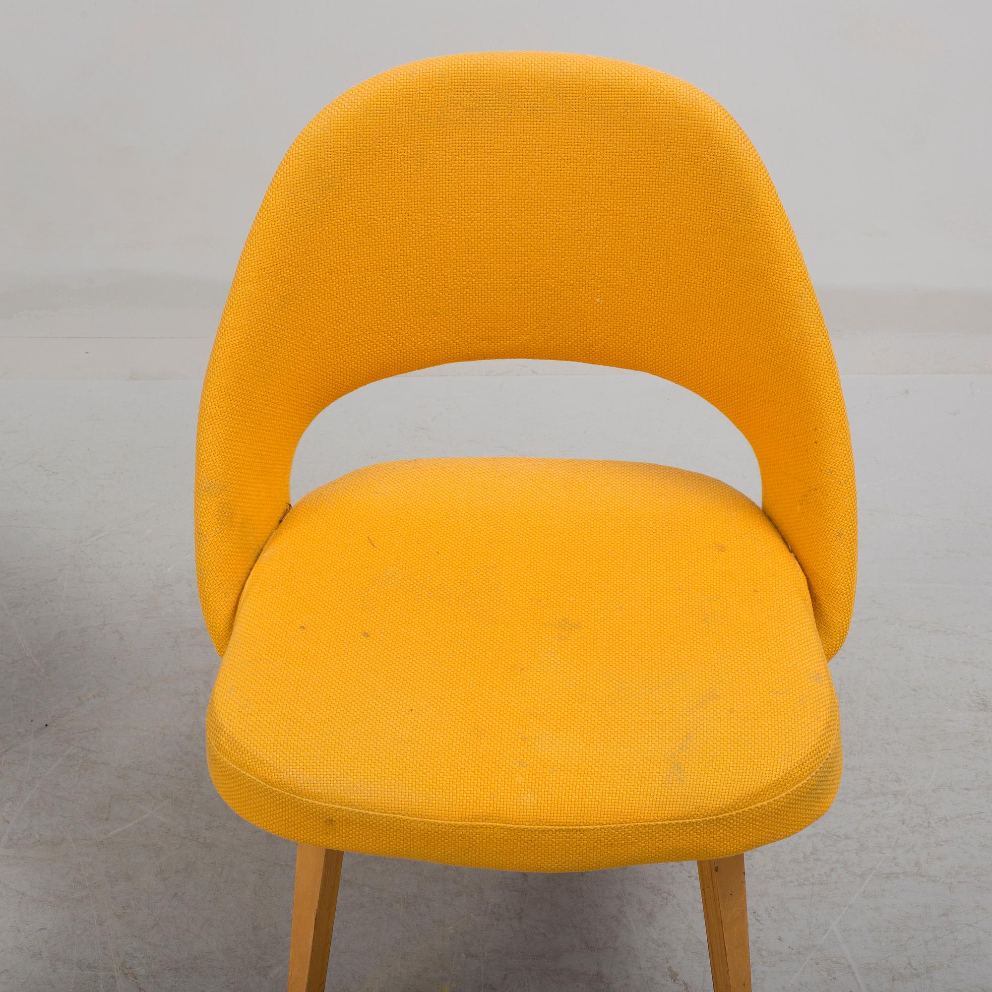 A group eight of Eero Saarinen executive side chair with wood legs, Knoll Products inc.
