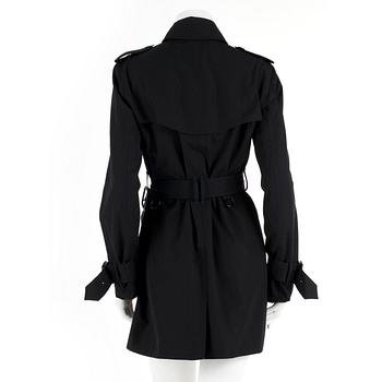 BURBERRY, a black cottonblend ladies trenchcoat. UK size 10.