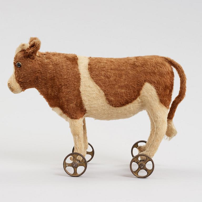 a STEIFF cow on wheels, Germany ca 1910.