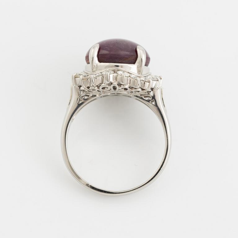 Purple star sapphire and brilliant cut diamond ring.