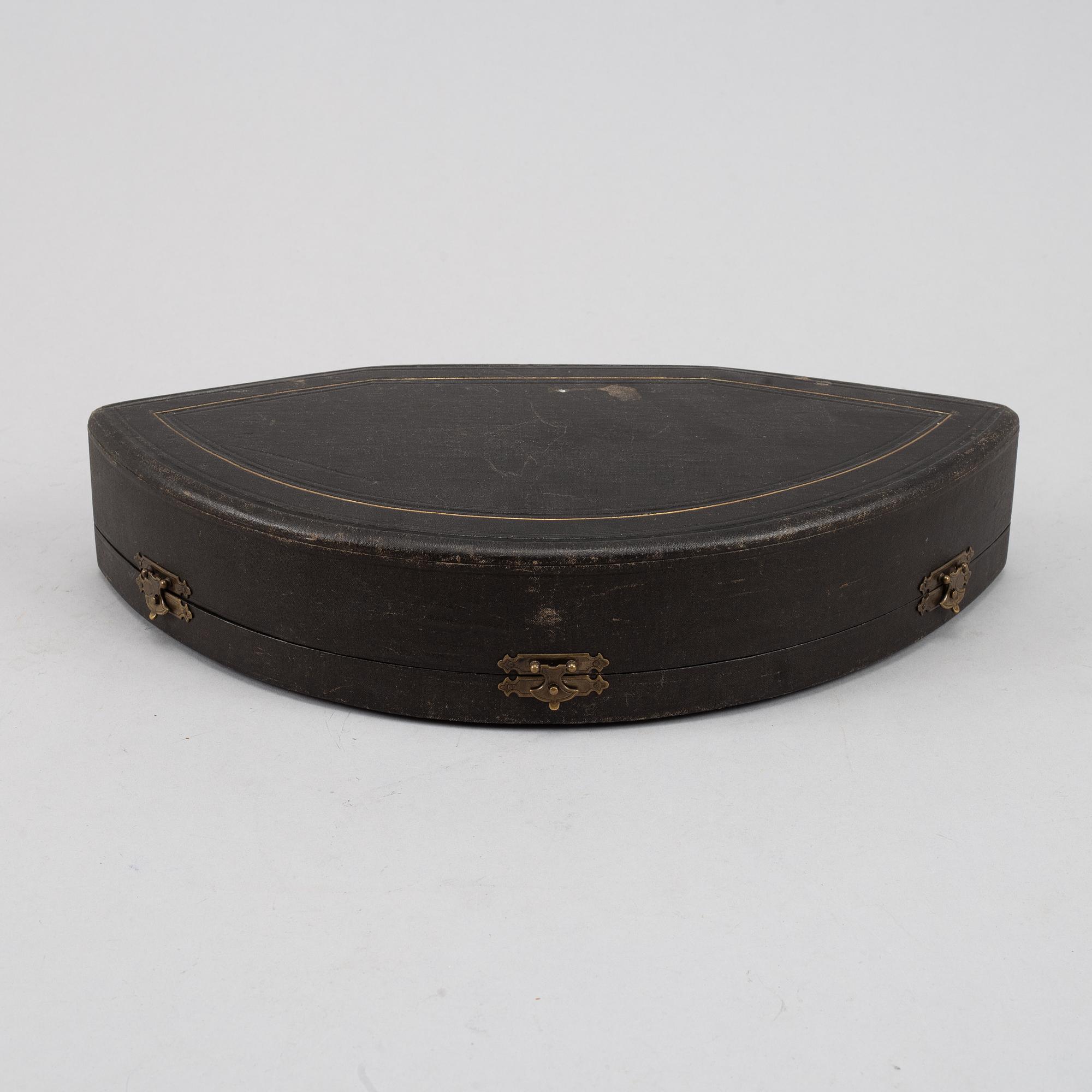 A set of six German parcel-gilt silver 800 salt cellars in fitted case.