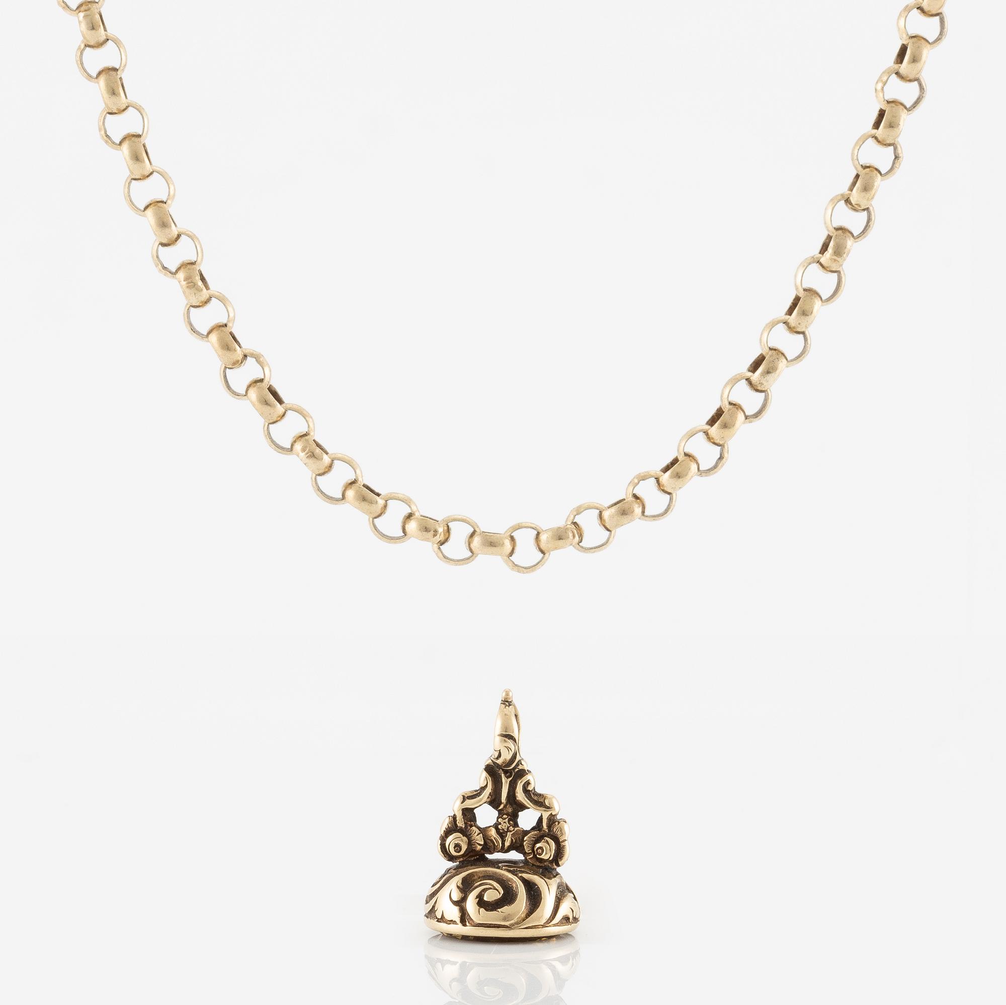 Sigill 14K guld och graverad gulaktig sten, möjligen citrin.