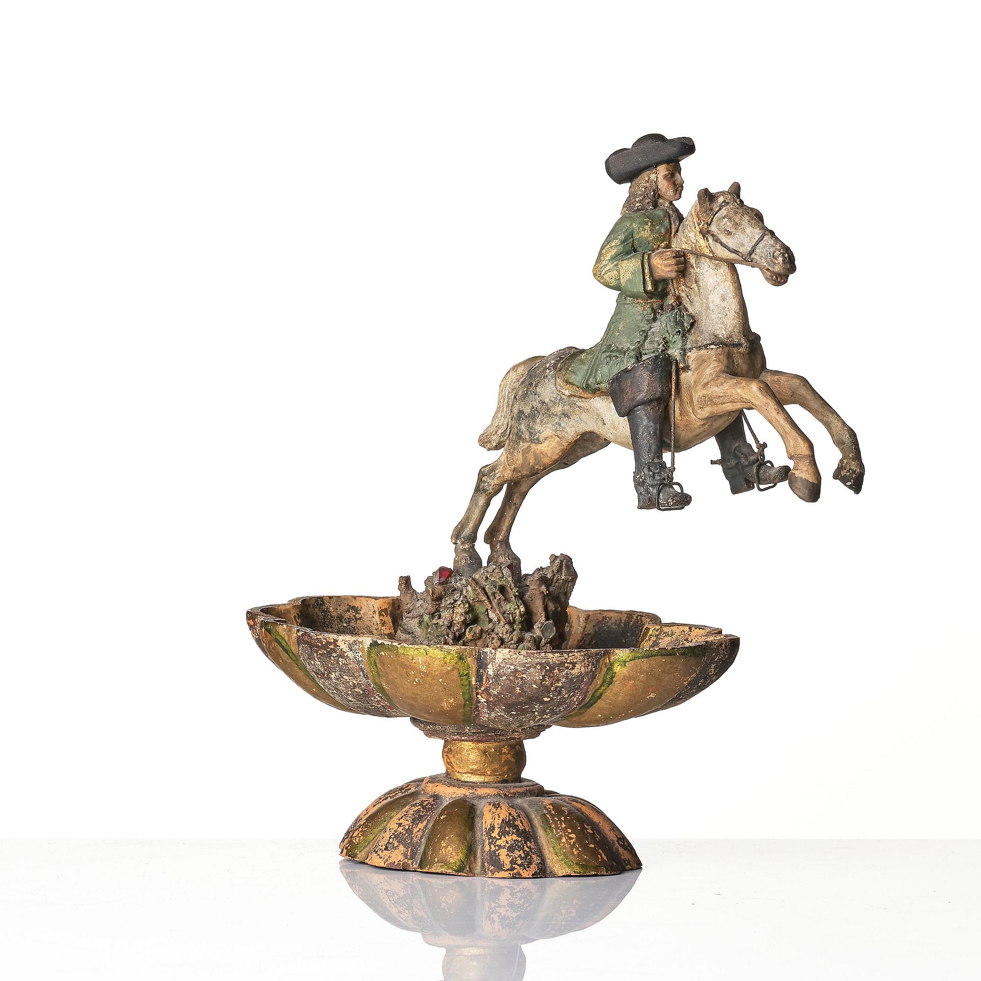 A pottered figure of a solider and horse, presumably late 17th century.