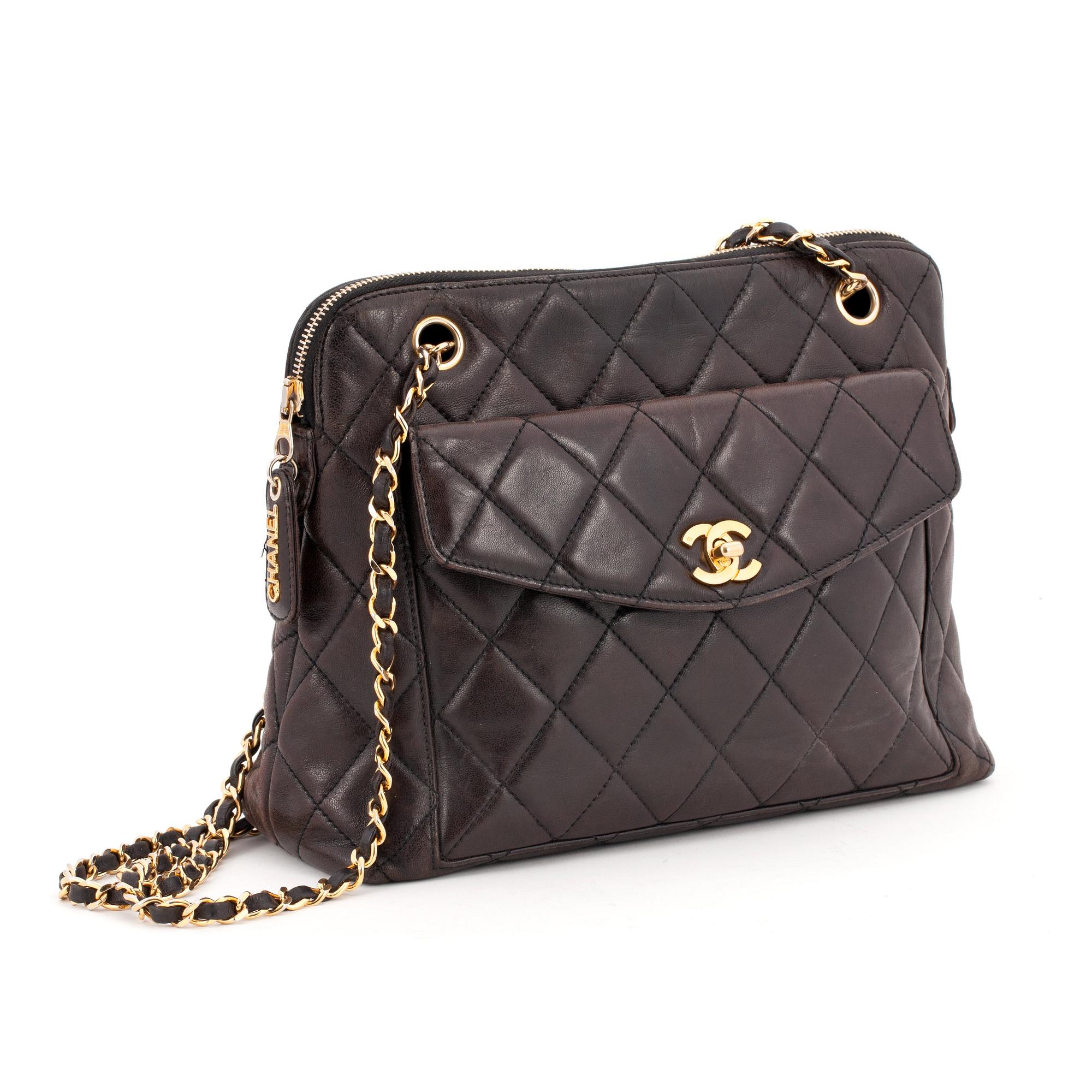 CHANEL, a quilted dark brown leather shoulder bag.