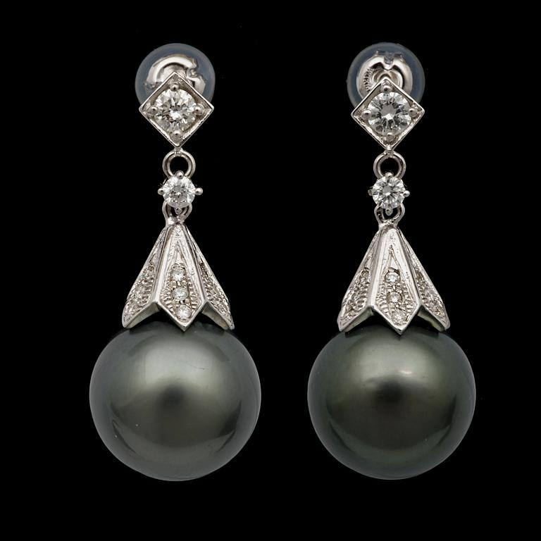 A pair of cultured Tahiti pearl, 13,3 mm, and brilliant cut diamond earrings.