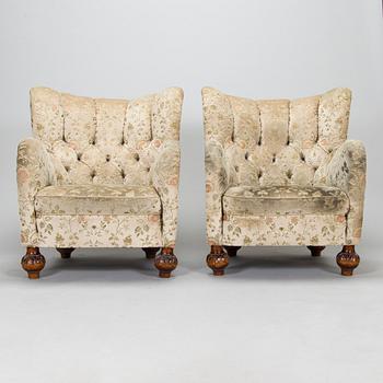 A pair of mid-20th-century armchairs.