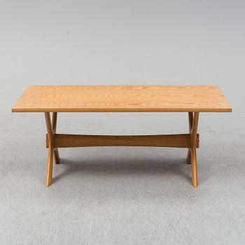 A 1960/70's pine sofa, armchair and coffee table.