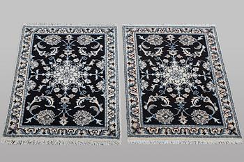 A pair of rugs, Nain, part silk, ca. 90 x 59 cm & ca. 89 x 58 cm.
