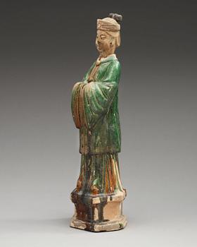 A green glazed pottery figure of a dignitary, Ming dynasty (1368-1644).