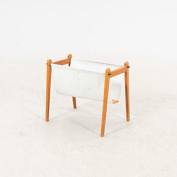 A 1960s teak newspaper holder.