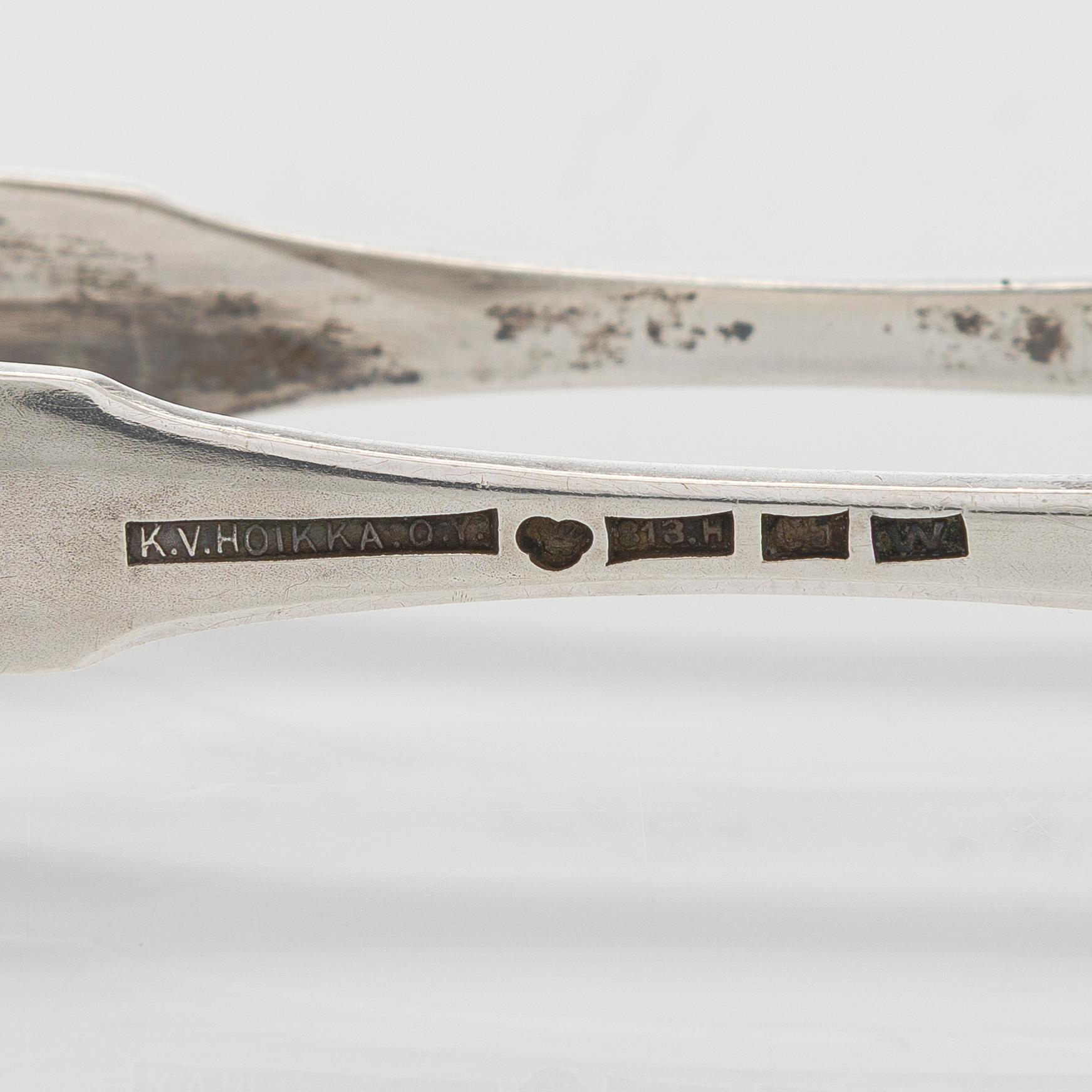 A set of two 1920s-1930s silver sweetmeat basket with sugar tong and jam spoon, Uusi Kultaseppä Oy, Helsinki, Finland.