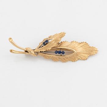 14K gold and sapphire leaf brooch.