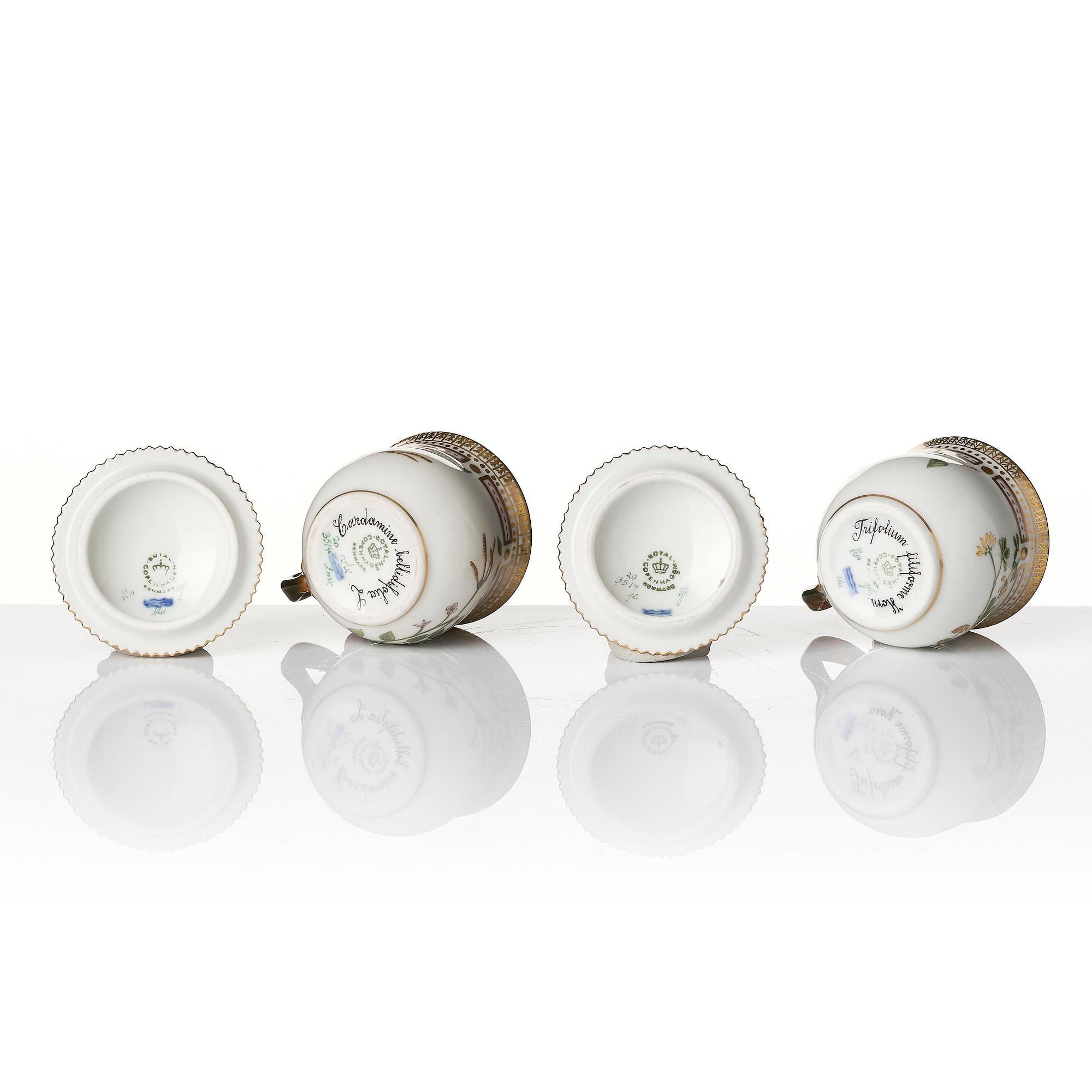 A set with four Royal Copenhagen 'Flora Danica' custard cups with covers and stands, Denmark, 20th century.