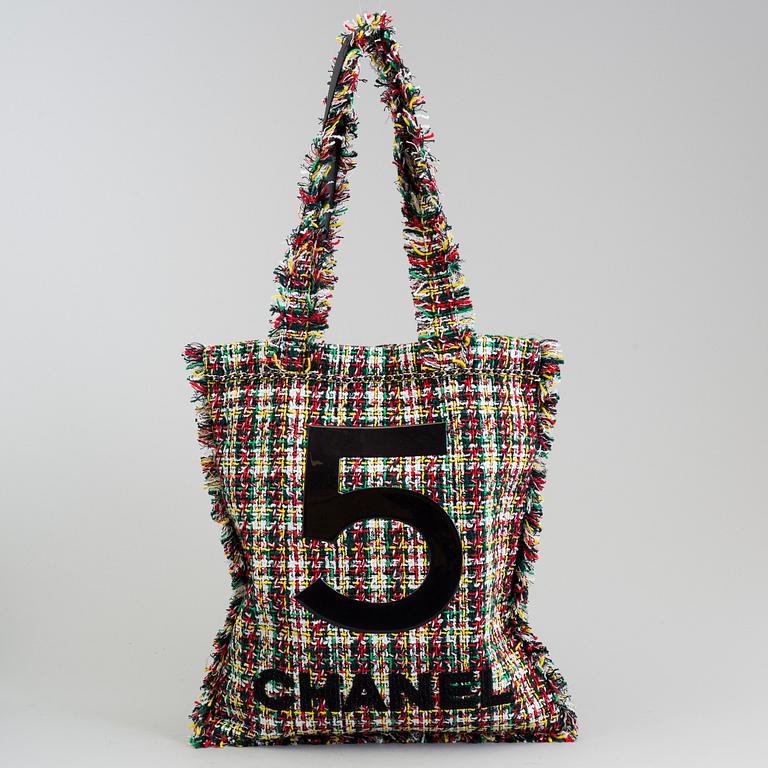 Tweed 5 shopping bag by Chanel.