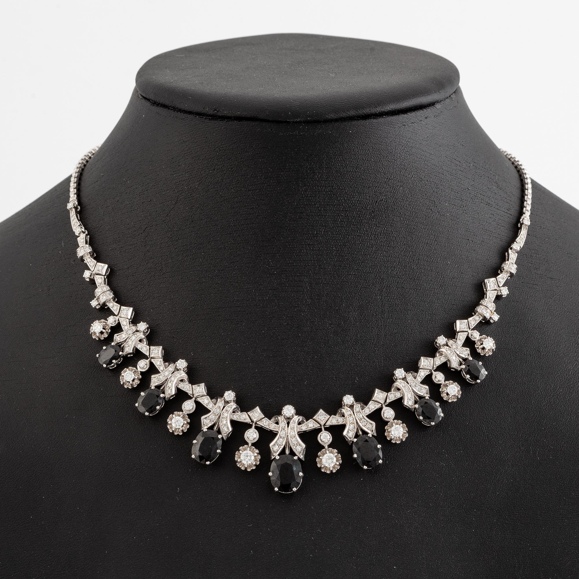 Necklace 18K white gold with step-cut sapphires and round and eight-cut diamonds.