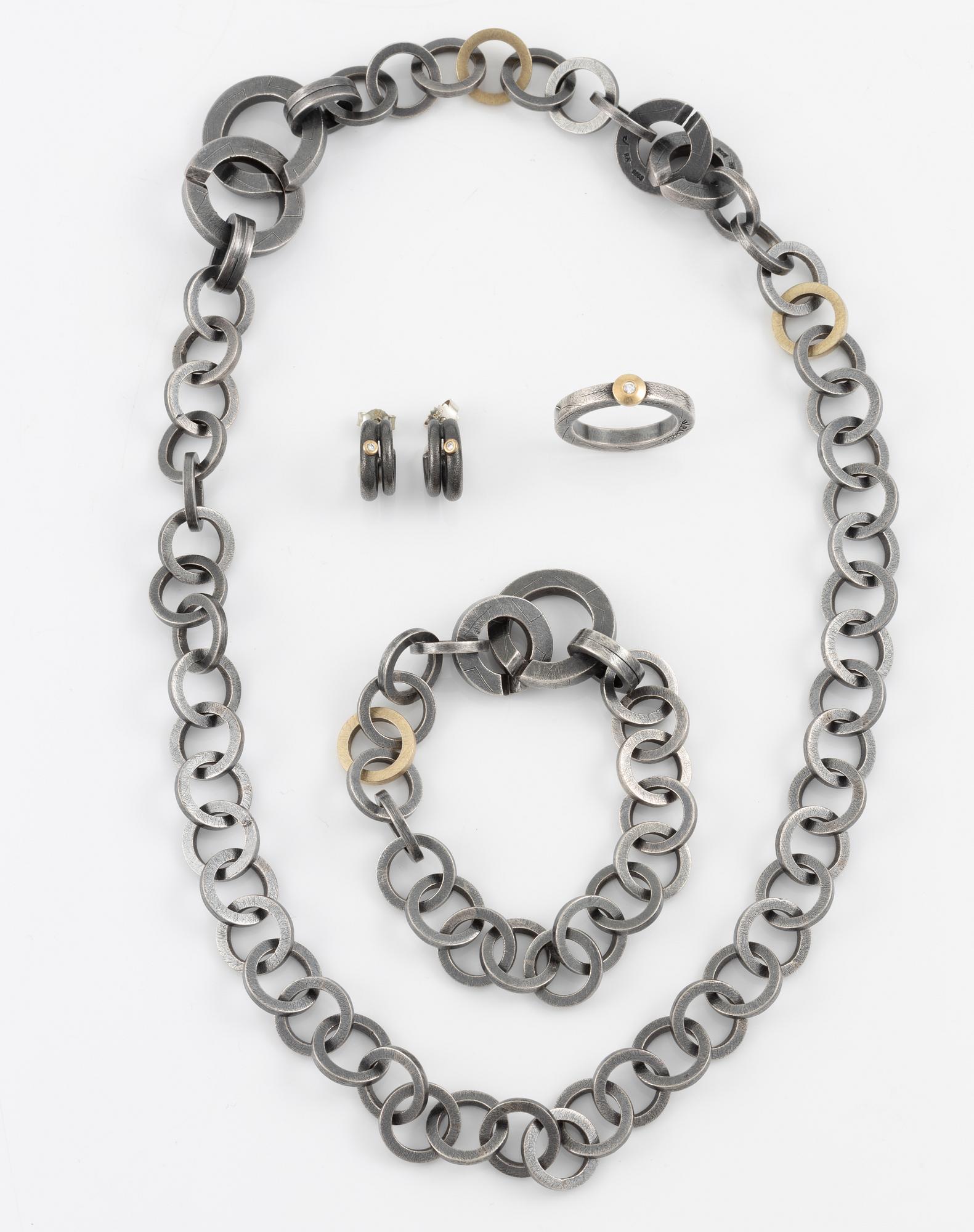 Bracelet, necklace, a pair of earrings, and a ring, Pia Rauff, silver with small diamonds.