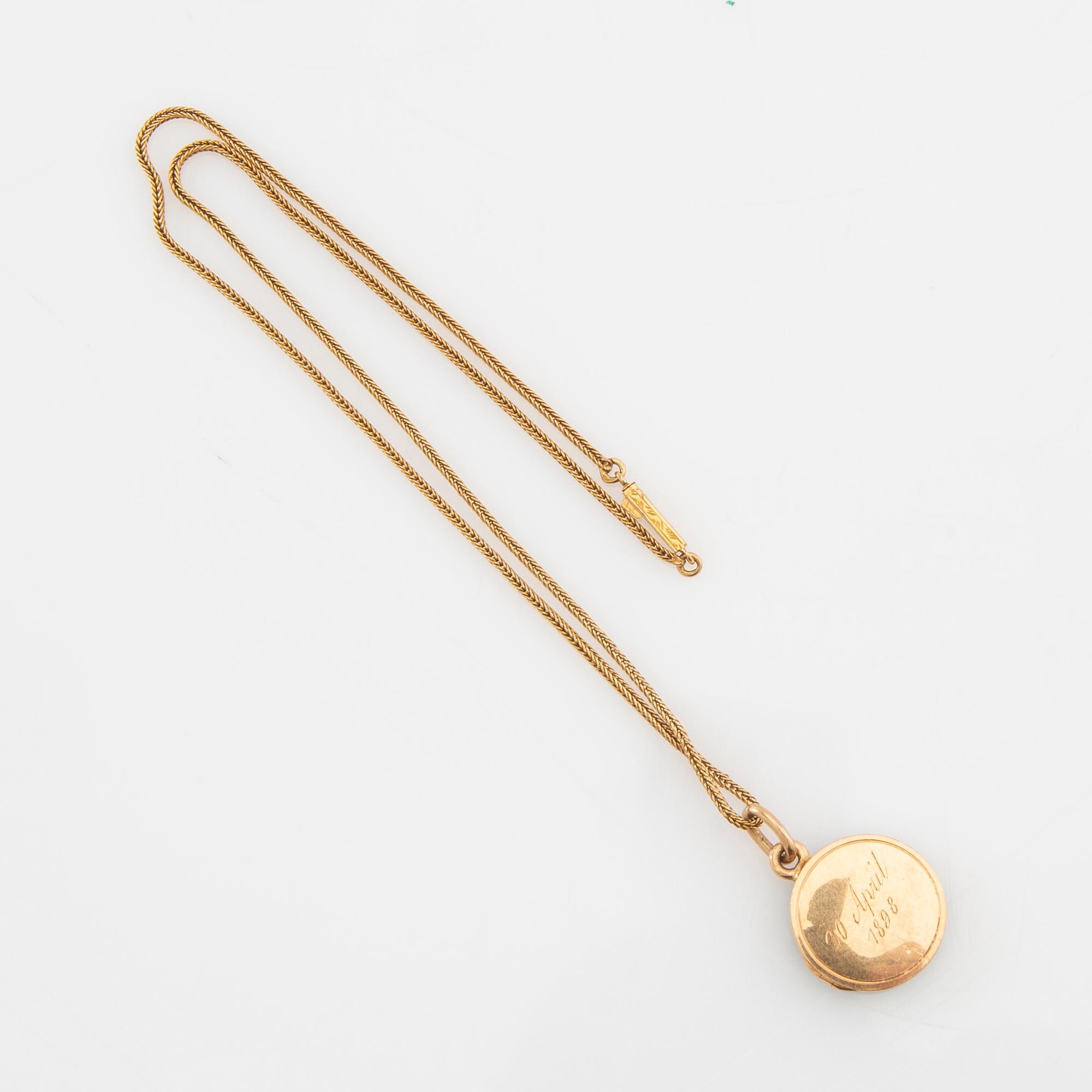 Halsband 18K guld med berlock.
