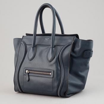 Céline, a teal leather 'Luggage' handbag.
