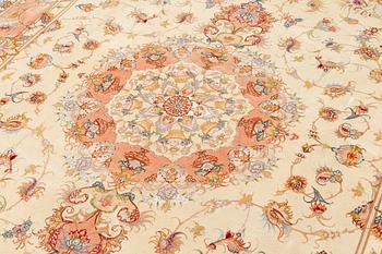 A Tabriz, part silk carpet, 50raj, signed, c. 300 x 200 cm.