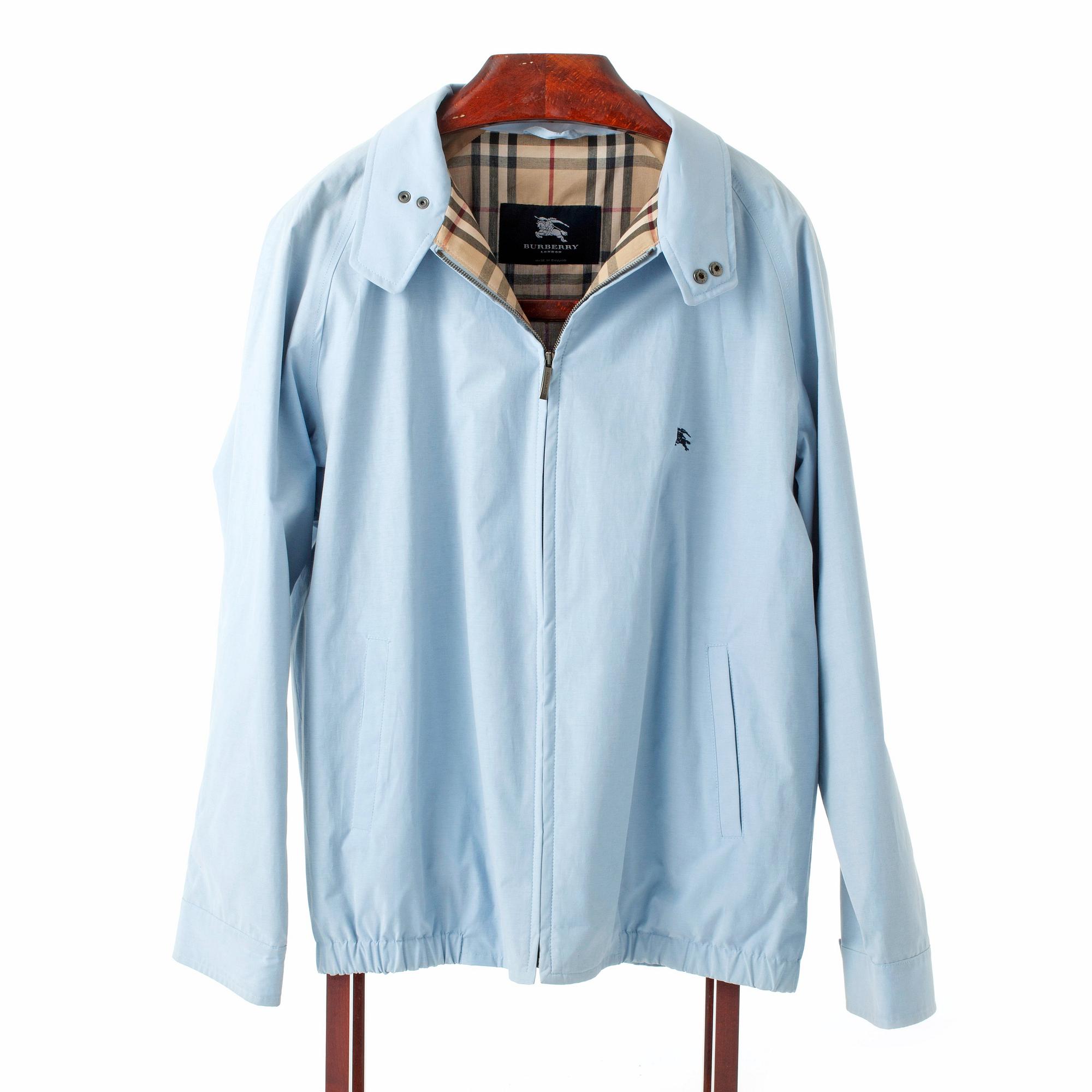 BURBERRY, a light blue cottonjacket.