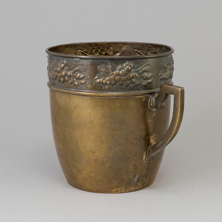 A brass jugend-style champagne cooler from early 21 st century.