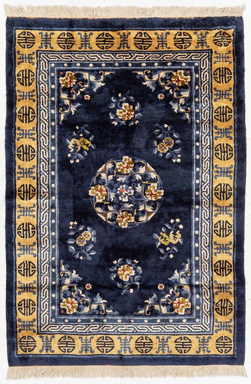 A semi-antique silk Chinaese 'Antique finish' rug, c. 175 x 122 cm.